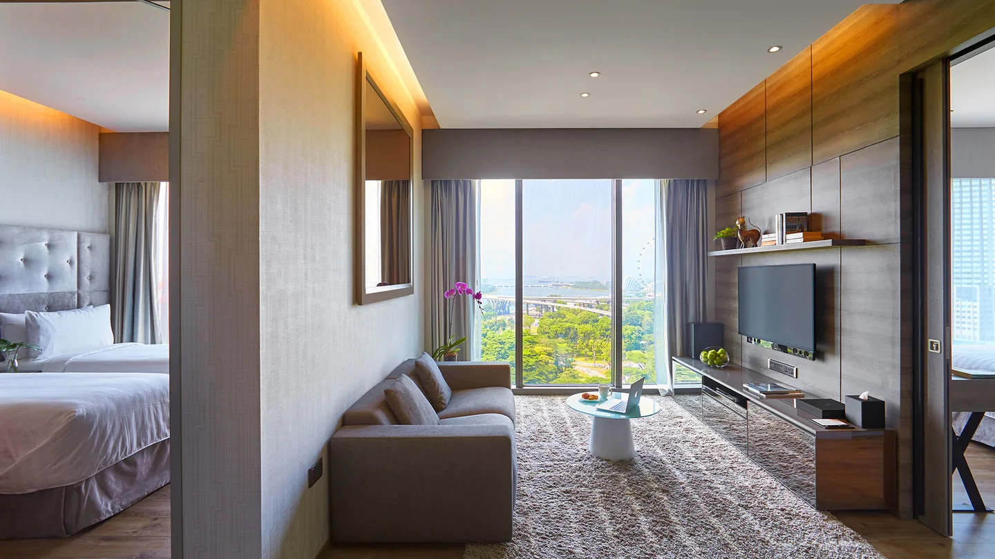 Living area and bedroom doorway in a Two Bedroom Premium Suite at Pan Pacific Serviced Suites Beach Road.